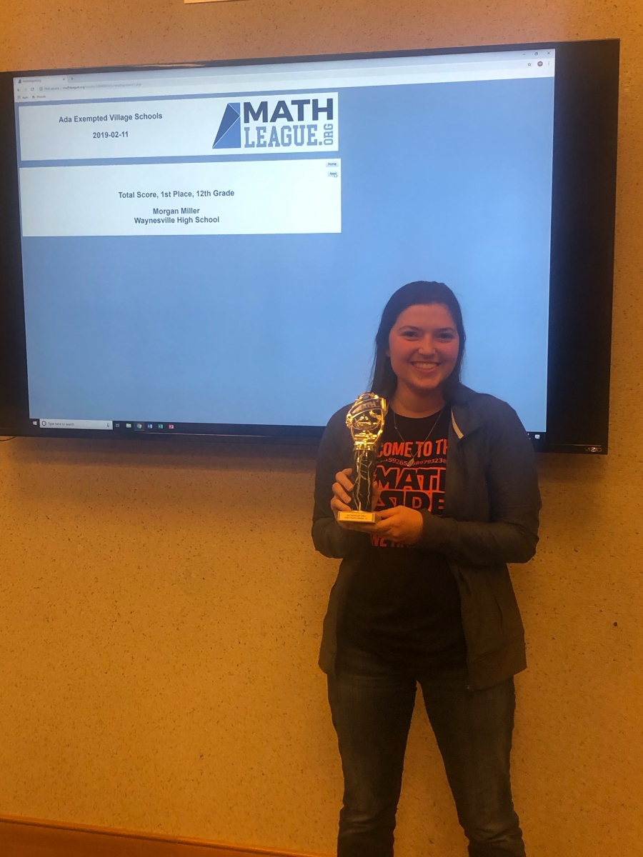 girl holding a trophy